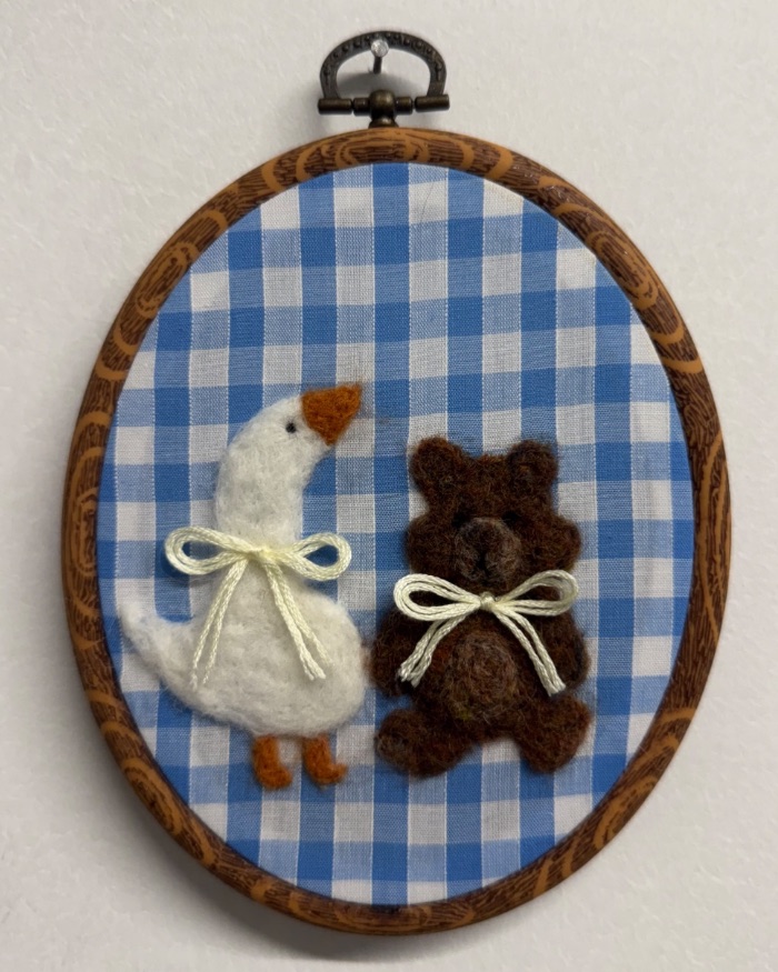 Needle felted goose and teddy bear with bow in a vintage style embroidery hoop — by Jasmin Clark — Textile